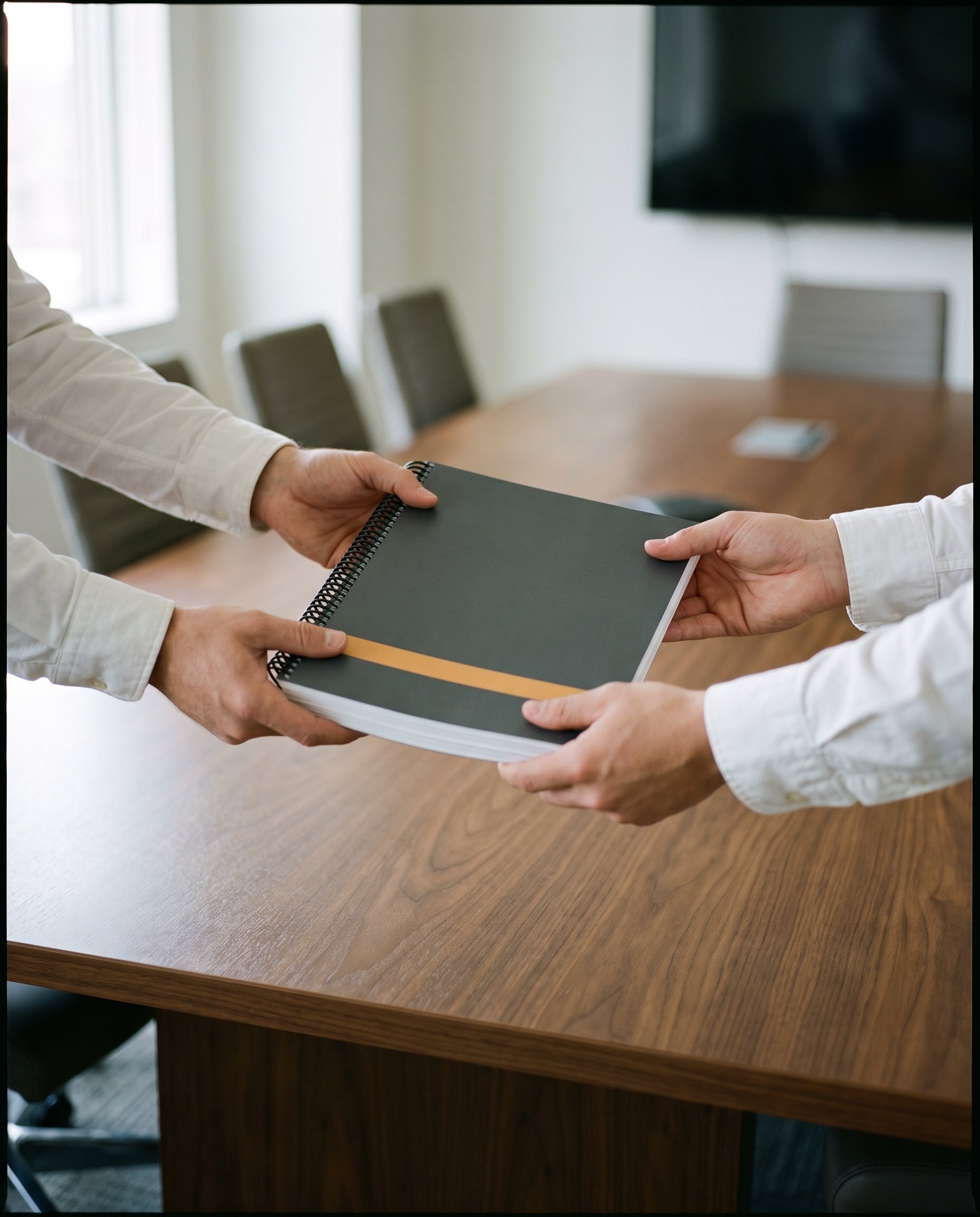 The assessment analysis handed across a conference table