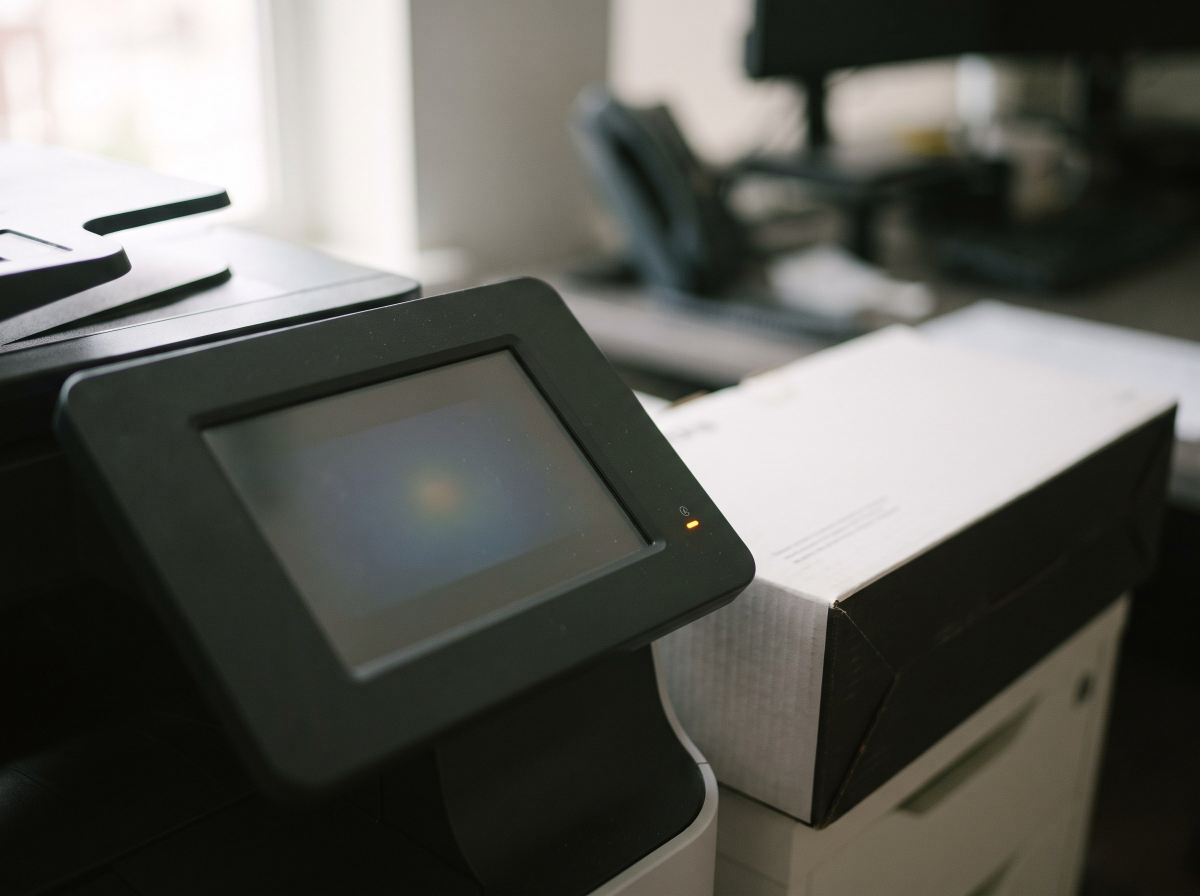 Multifunction printer control panel with a status light and a toner box